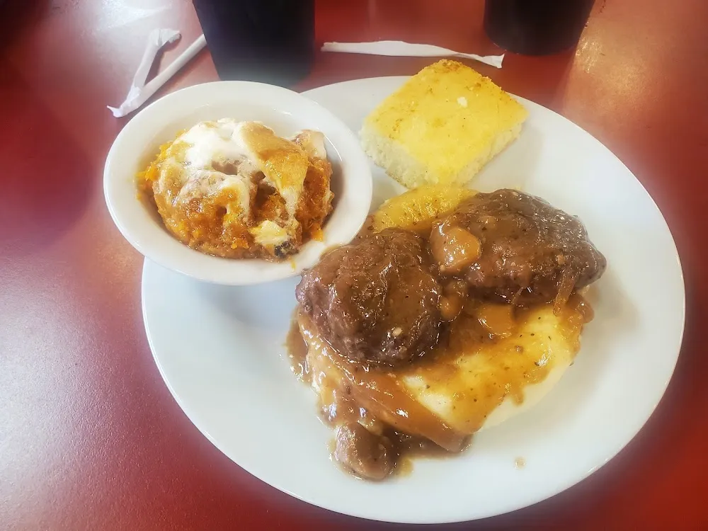 Country Style Steak with Mashed Potatoes Sweet Potato Casserole and Corn Bread